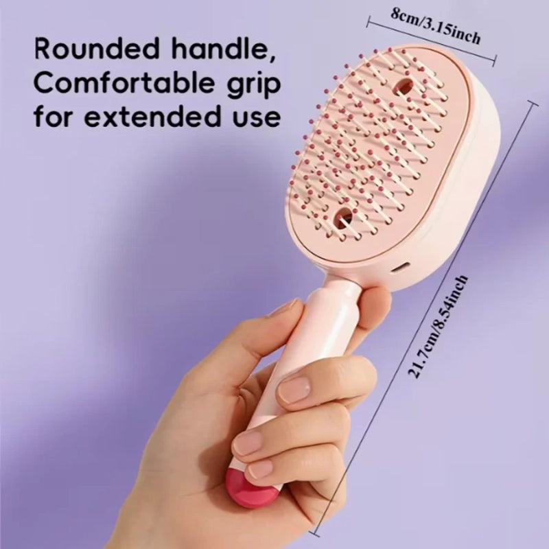 Elora heating massage brush being used to style hair